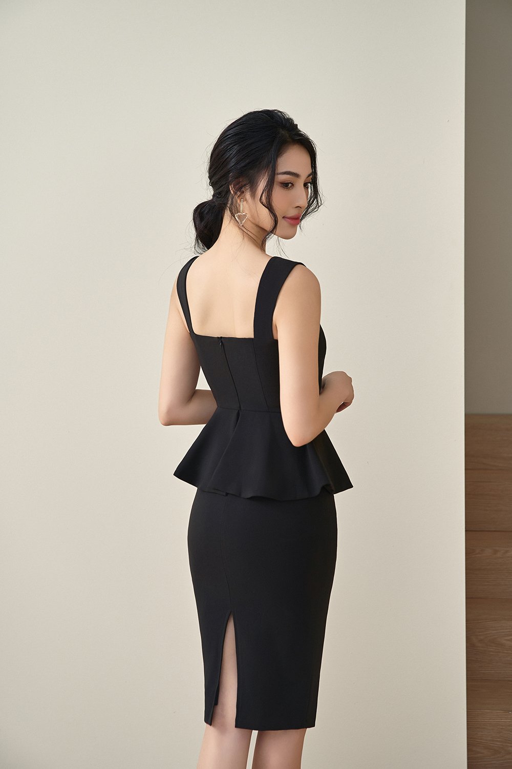 Calliope Twisted Bust Peplum Pencil Dress in Classic Black