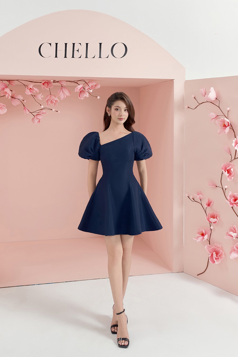 Cleo Asymmetrical Flare Mini Dress in Navy Blue