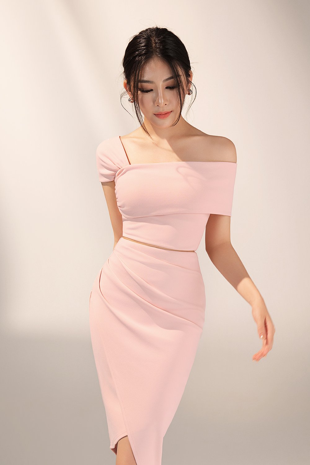 Tiana Padded Asymmetrical Cropped Top in Ballet Pink