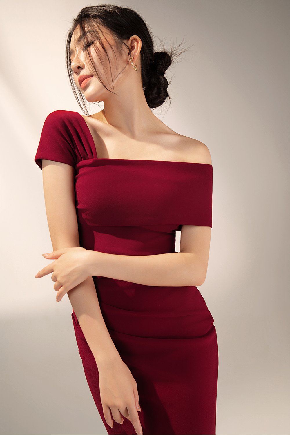Tiana Padded Asymmetrical Cropped Top in Wine Red