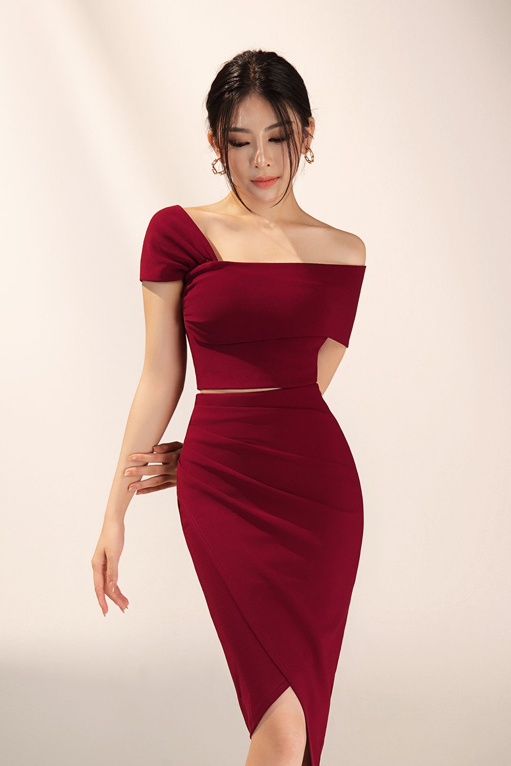 Tiana Padded Asymmetrical Cropped Top in Wine Red