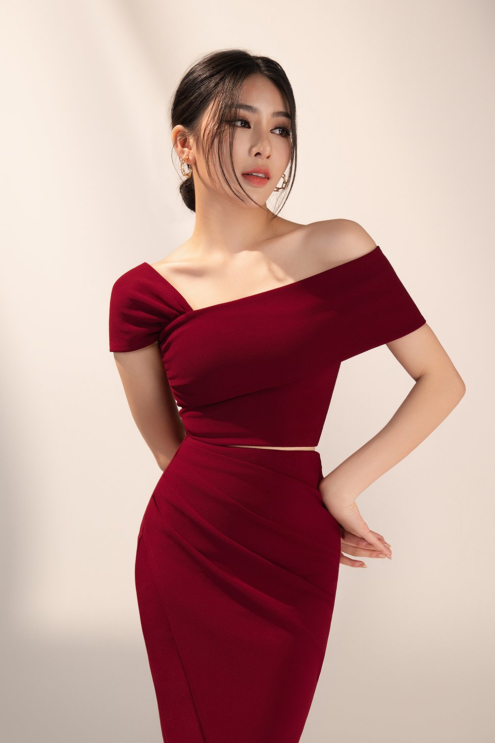 Tiana Padded Asymmetrical Cropped Top in Wine Red