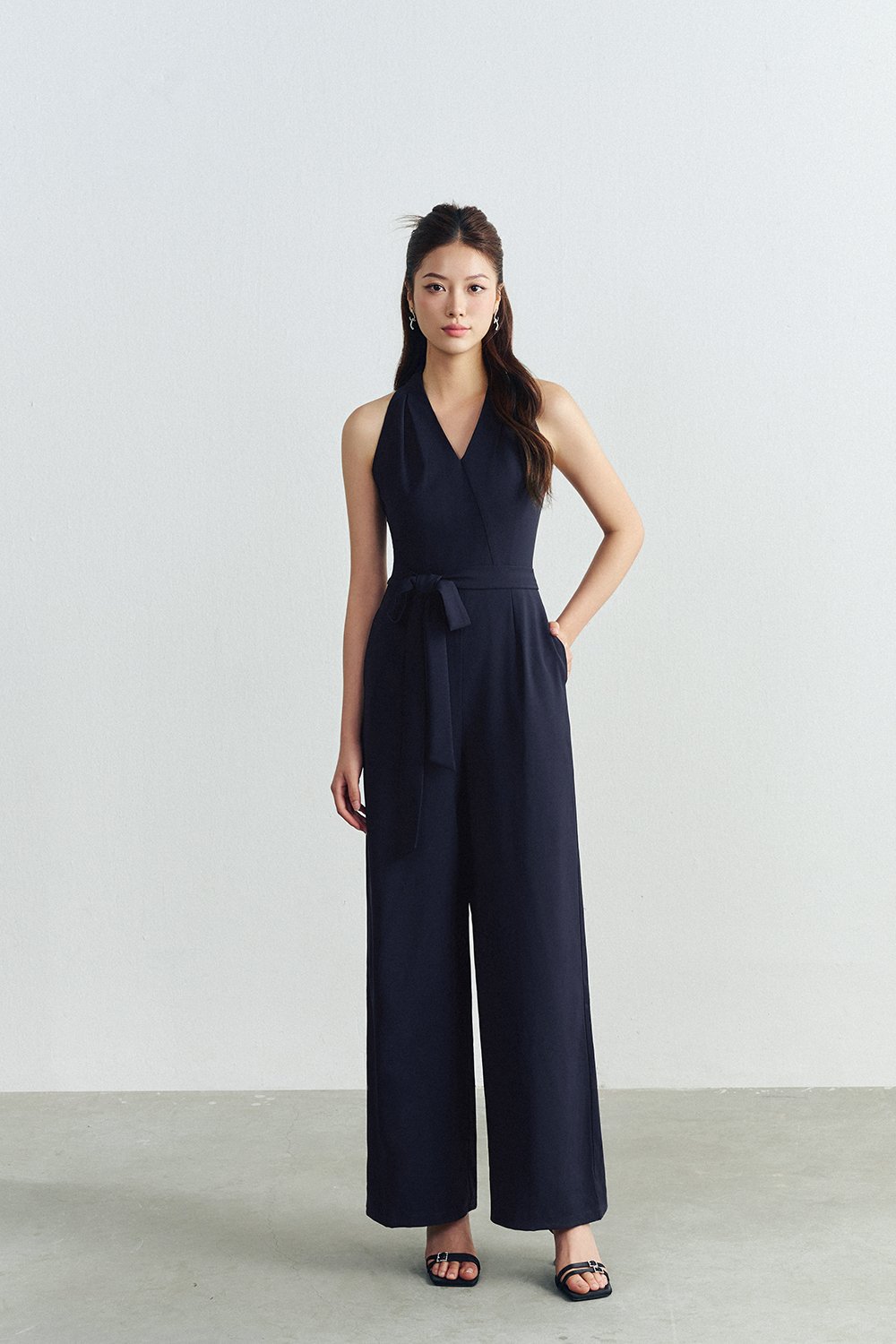 Juni Pleated V-Neck Jumpsuit with Sash Belt in Navy Blue