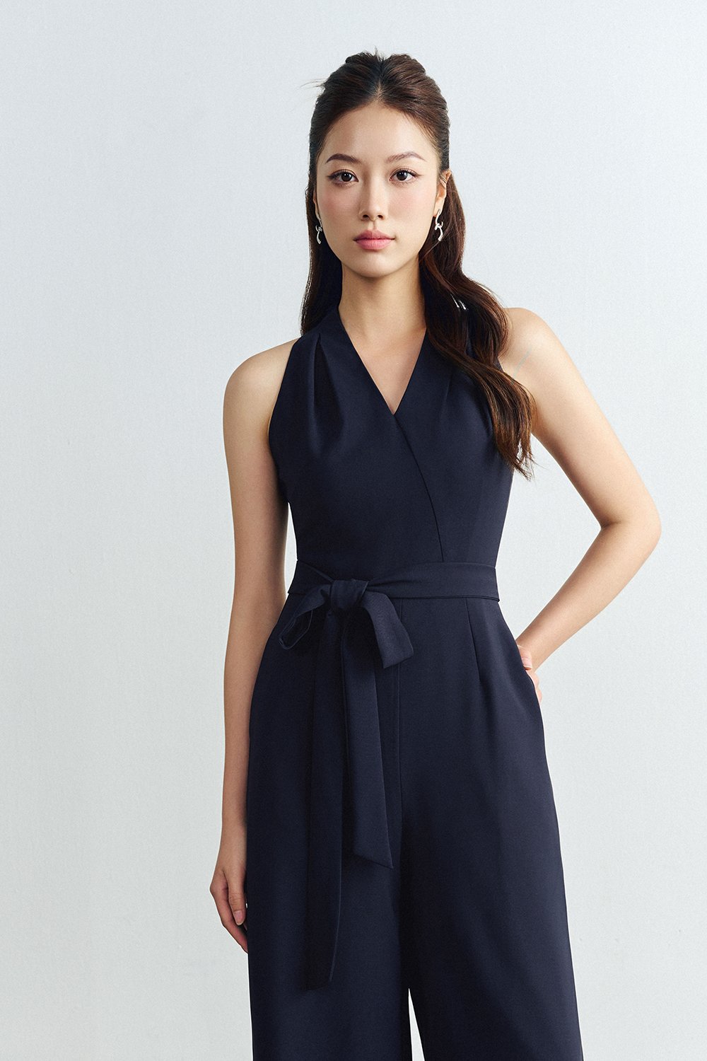 Juni Pleated V-Neck Jumpsuit with Sash Belt in Navy Blue