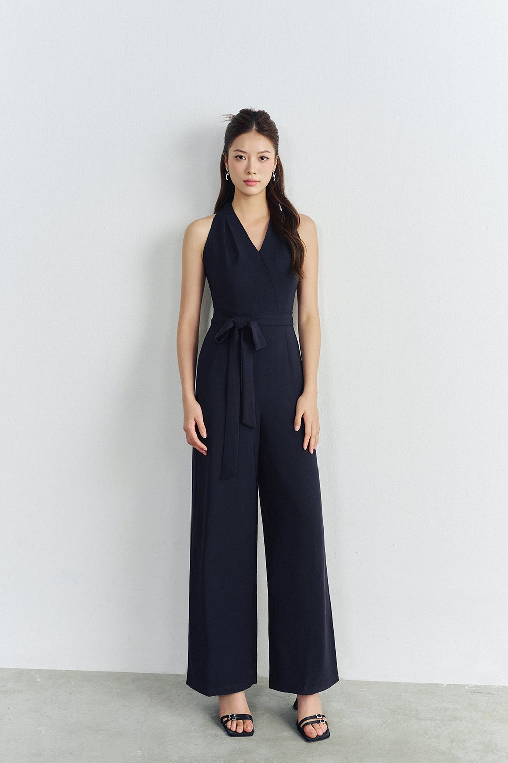 Juni Pleated V-Neck Jumpsuit with Sash Belt in Navy Blue