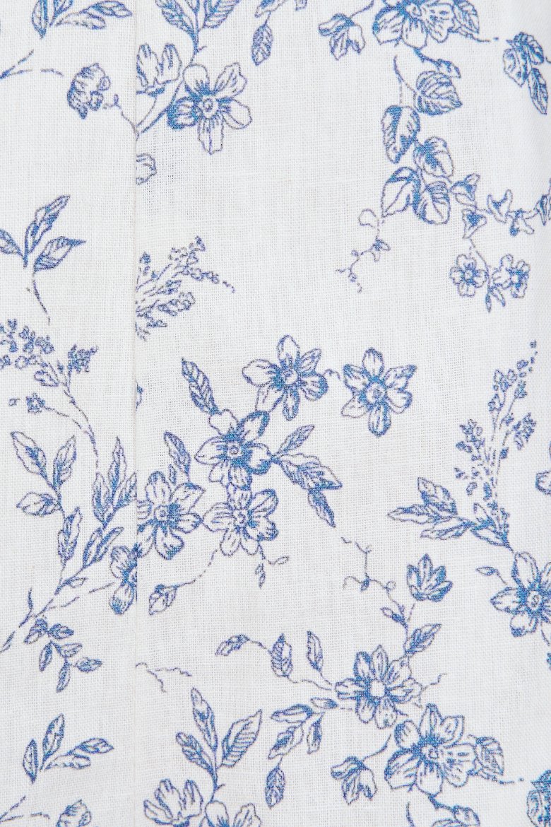 Monique Padded V-Neck Ruffle Cut-Out Romper in Trailing Blooms