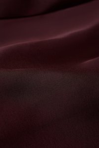 Aviva Sateen Pleated High Waist Shorts in Pinot Noir