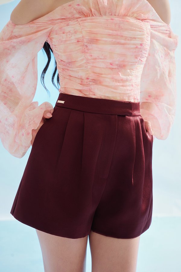 Aviva Sateen Pleated High Waist Shorts in Pinot Noir