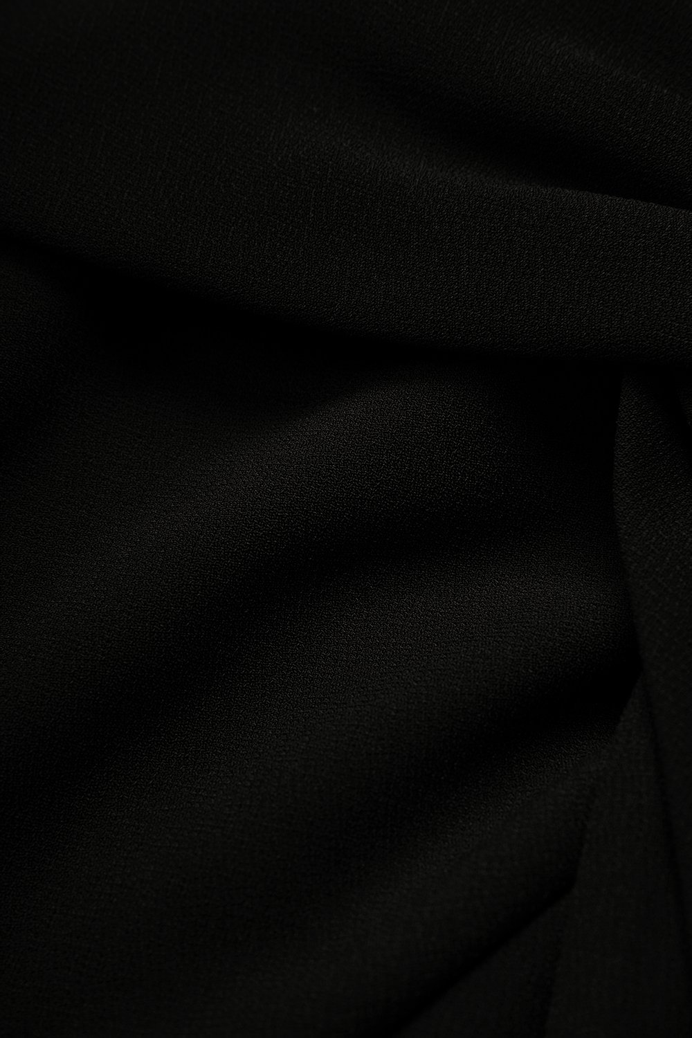 Elaine Padded Asymmetrical Twist Top in Classic Black