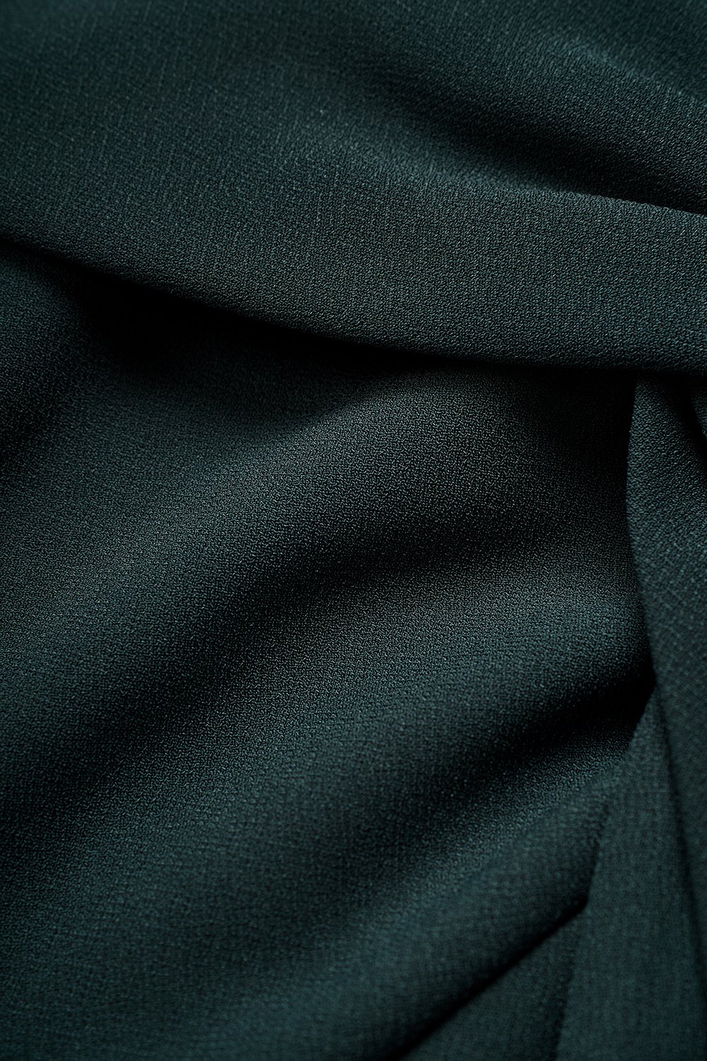 Elaine Padded Asymmetrical Twist Top in Emerald Green