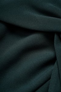 Elaine Padded Asymmetrical Twist Top in Emerald Green