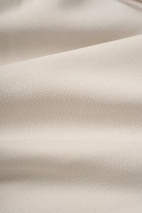 Rachel Padded Asymmetrical Wrap Top in Ivory