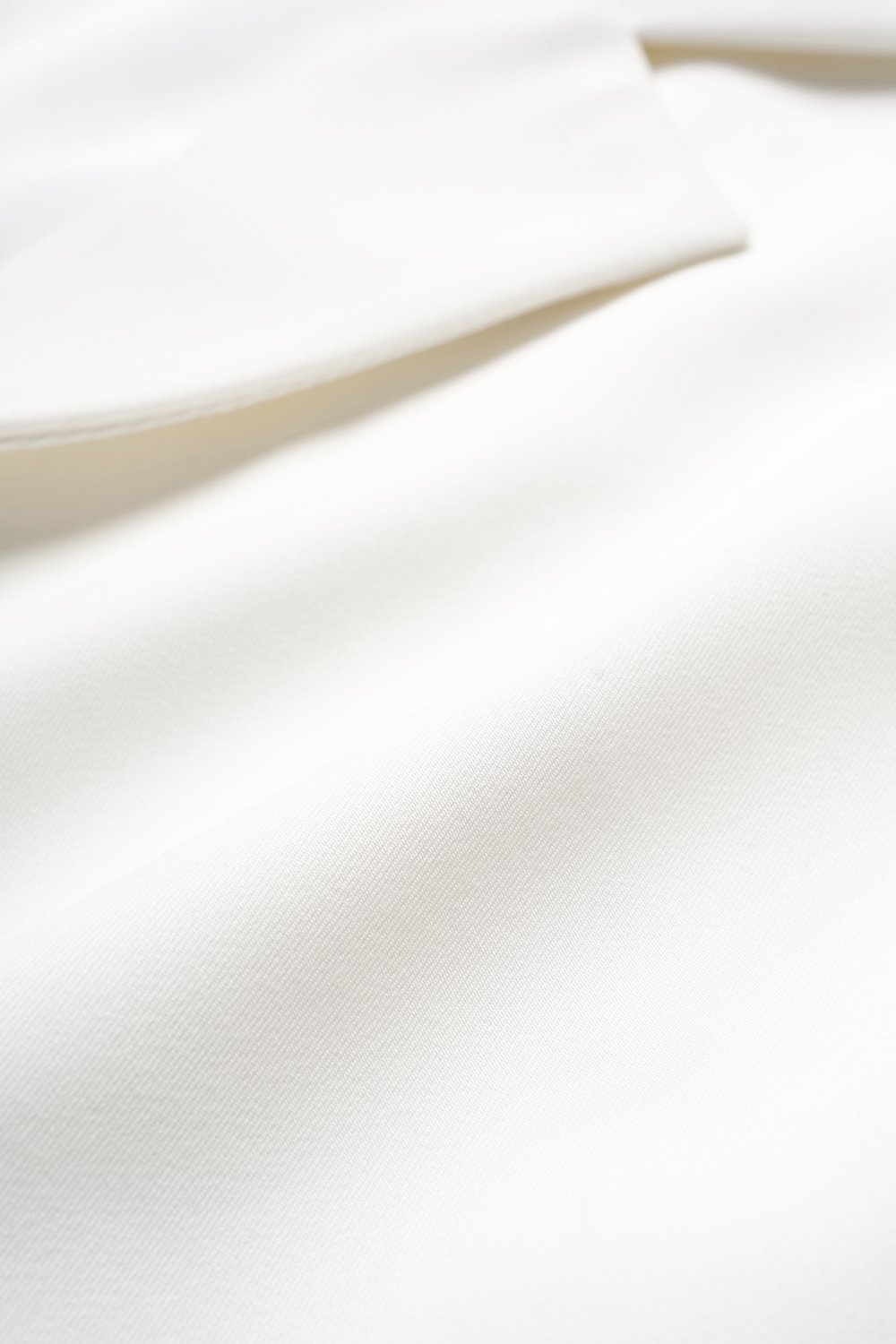 Louisa Padded Asymmetrical Collared Top in Iconic White