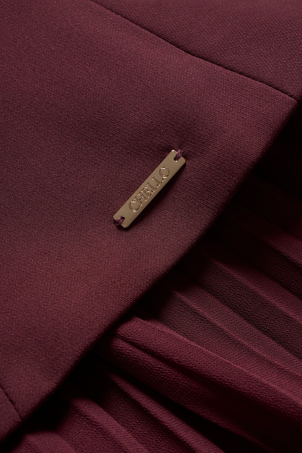 Cyrille Padded Peplum Pleated Dress in Wine Red