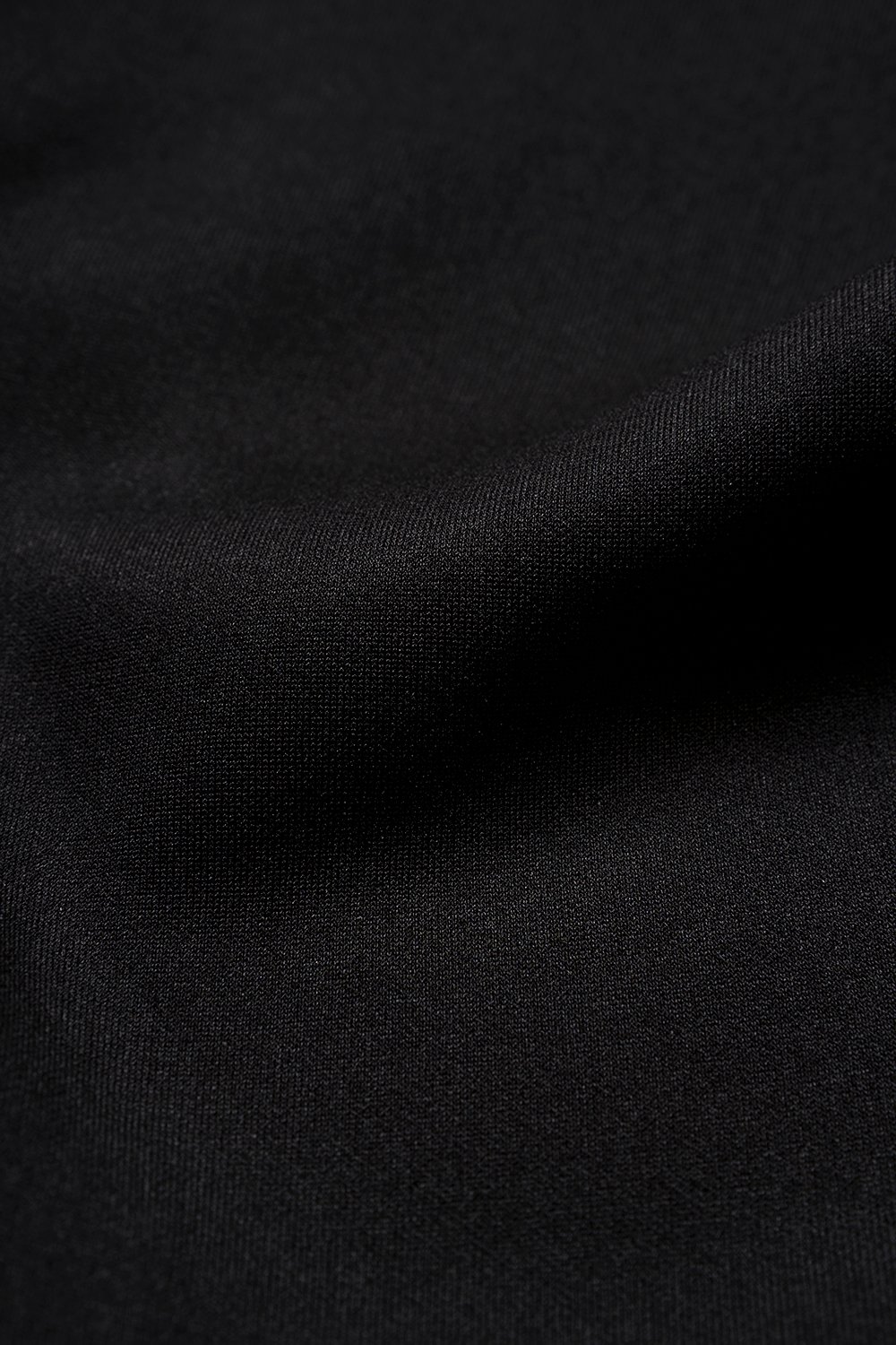 Eula Padded Asymmetrical Shoulder Crop Top in Classic Black