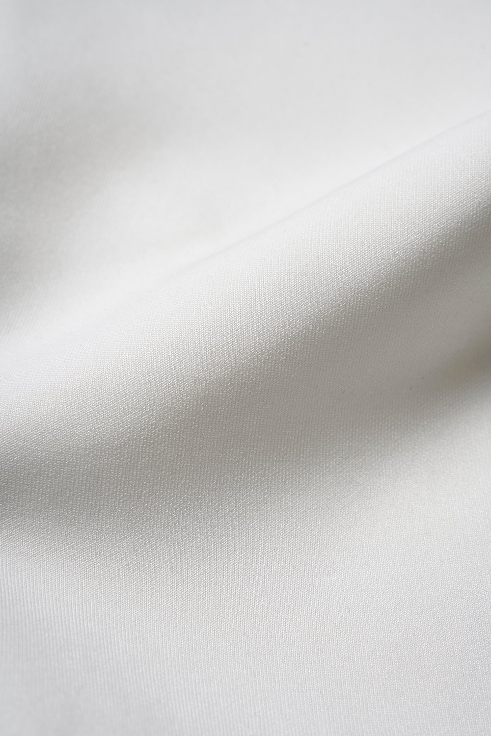 Eula Padded Asymmetrical Shoulder Crop Top in Iconic White