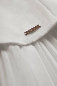 Cyrille Padded Peplum Pleated Dress in Iconic White