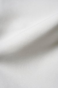 Eula Padded Asymmetrical Shoulder Crop Top in Iconic White